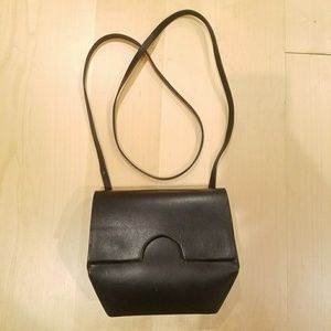 Geometric black leather crossbody bag from COS